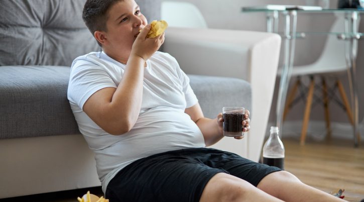 Fat,Overweight,Teenager,Boy,Has,Bad,Nutrition,,Eat,Unhealthy,Food. bimboobeso