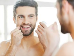 cleaning-teeth-with-dental-floss- cleaning teeth with dental floss