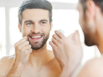 cleaning-teeth-with-dental-floss- cleaning teeth with dental floss