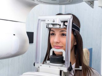 Girl taking digital 3D panoramic dental x-ray. ortopantomografia emicenter napoli