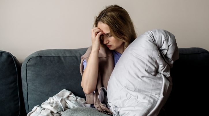 Young,Woman,With,Long,Covid,Syndrome,-,Painful,Condition,,Headache, shutterstock 2069308112